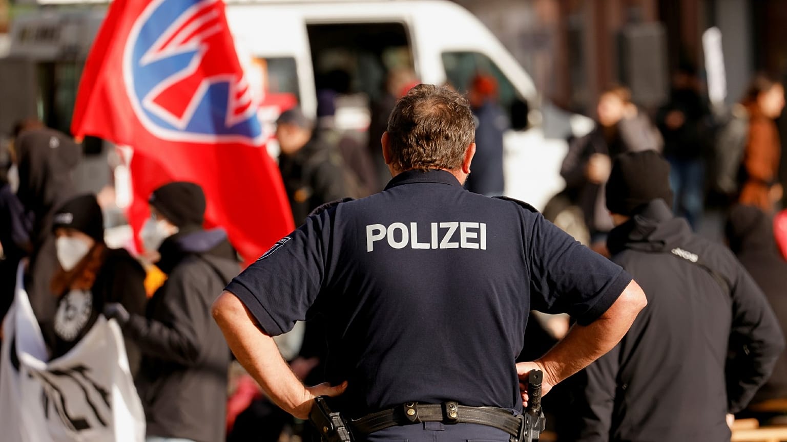 Police patrol as people gather during a vigil against the ultra-right so-called Der Dritte Weg (The Third Way), in Guben, Germany