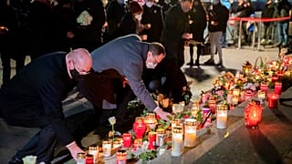 Candles are laid during a memorial service on the 4th anniversary of the attack on the Christmas market at Breitscheidplatz, in Berlin, Germany, Saturday, Dec. 19, 2020