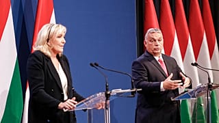 French far-right leader Marine le Pen stands during a joint press conference with Hungarian Prime Minister Viktor Orban in Budapest, Hungary, Tuesday, Oct. 26, 2021.