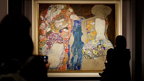 People admire Gustav Klimt's oil on canvas painting "The Bride" (1918) on display at the exhibition "Klimt. The Secession and Italy" at the Museum of Rome