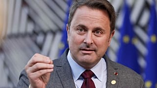 Luxembourg's Prime Minister Xavier Bettel talks to journalists as he arrives for an EU summit in Brussels.