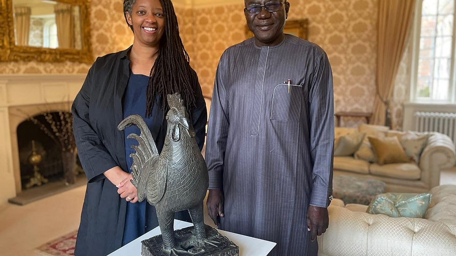 Master of Jesus College Sonita Alleyne and Director-General of the National Commission for Museums and Monuments of Nigeria, Abba Isa Tijani with the "Okukor".