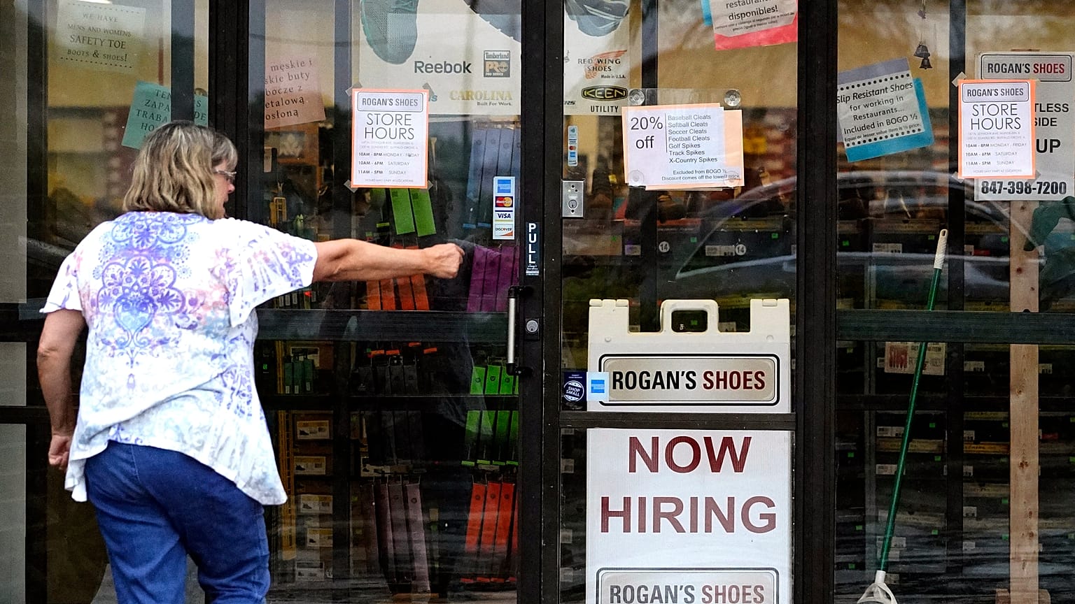 A hiring sign is displayed outside a retail store in Buffalo Grove, Illinois, US, June 24, 2021. 
