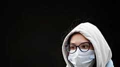 A young woman wearing a face mask to help curb the spread of the coronavirus leaves a subway in Moscow, Russia, Friday, Oct. 15, 2021. 