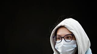 A young woman wearing a face mask to help curb the spread of the coronavirus leaves a subway in Moscow, Russia, Friday, Oct. 15, 2021. 