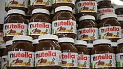 This photo taken on January 30, 2018 in Saint-Gregoire, near Rennes, northwest France, shows containers of Nutella.