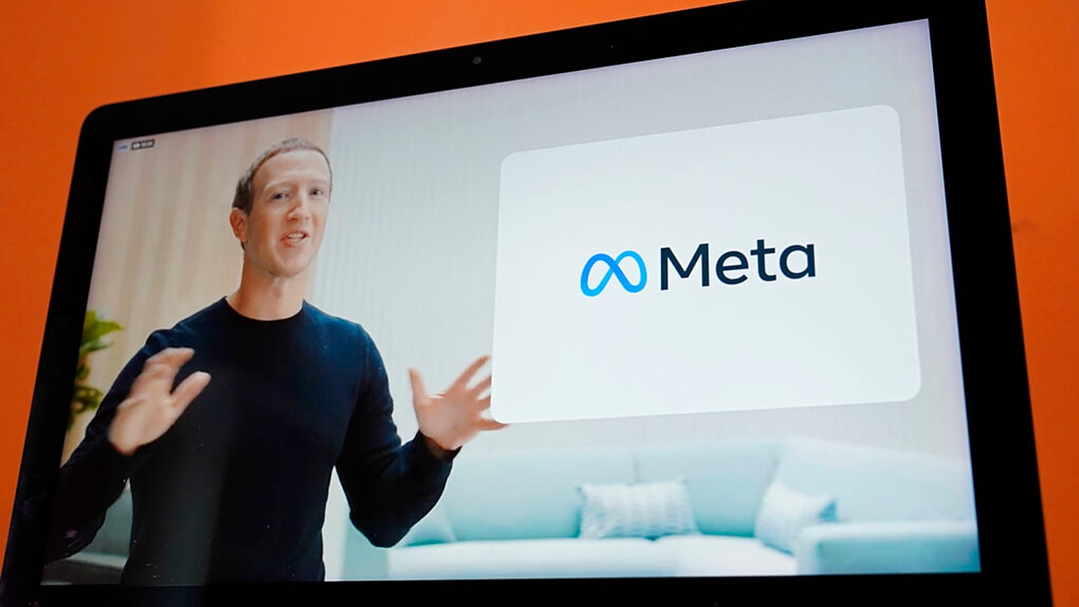 Seen on the screen of a device in Sausalito, Calif., Facebook CEO Mark Zuckerberg announces their new name, Meta