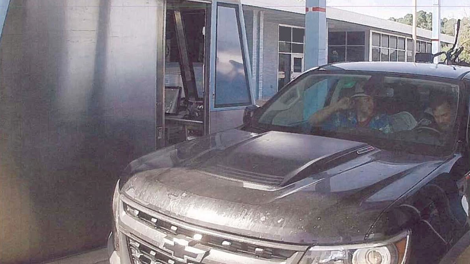 Brian Mark Lemley Jr, driving, and Patrik Mathews, passenger seat, passing through a toll booth near Norfolk, Va., en route to Georgia Sept. 14, 2019.