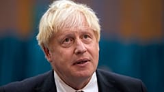 In this Friday, Oct. 22, 2021 file photo, British Prime Minister Boris Johnson visits a COVID-19 vaccination centre in London.