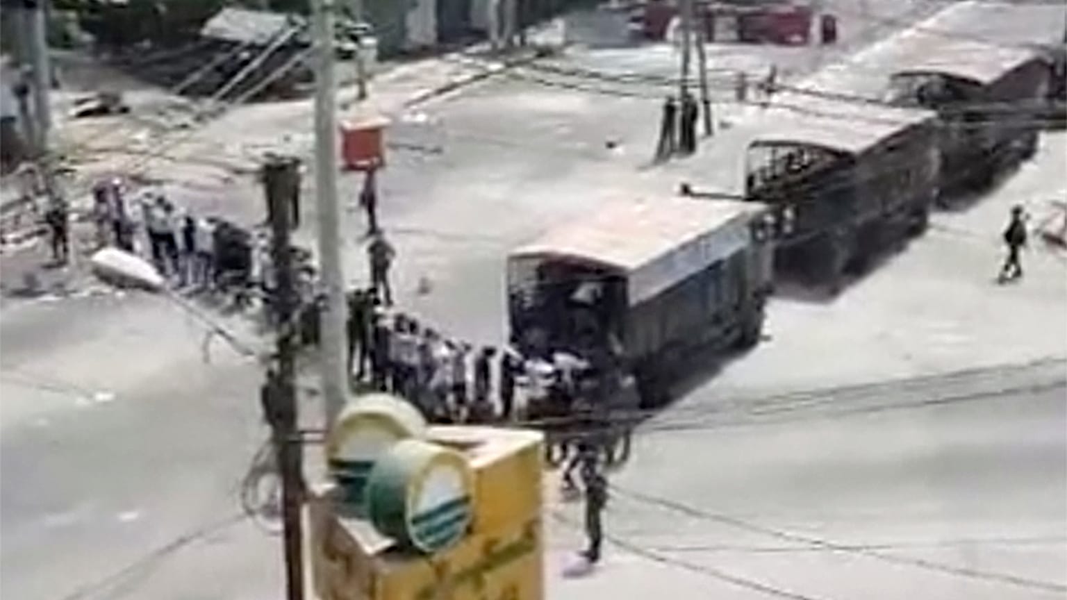 In this image from video obtained by The Associated Press, soldiers line up arrested protesters in Yangon, Myanmar on March 3, 2021. 