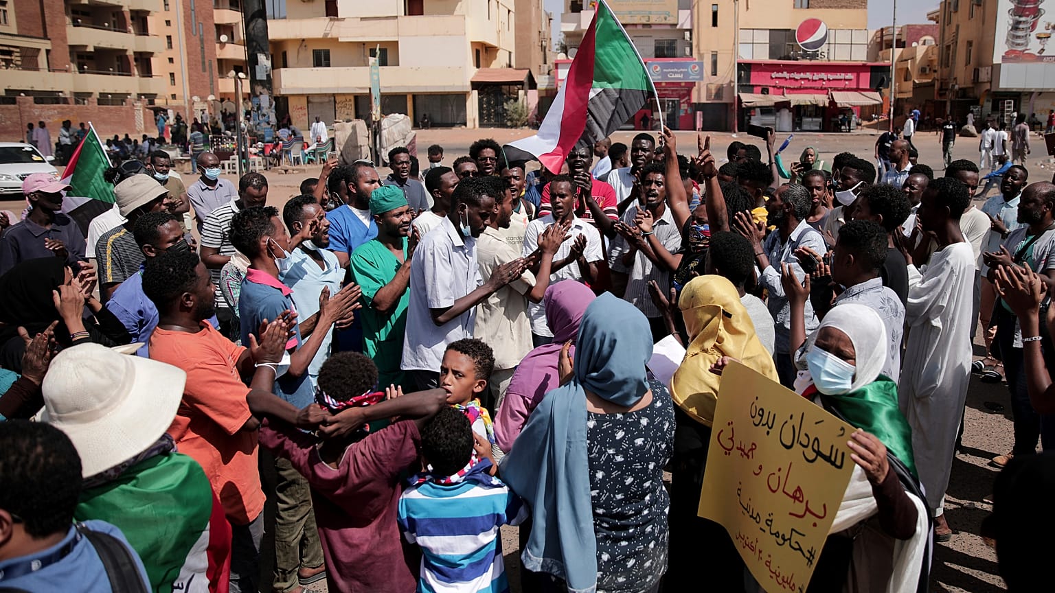 People chant slogans during a protest in Khartoum, Sudan, Saturday, Oct. 30, 2021