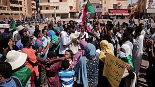 People chant slogans during a protest in Khartoum, Sudan, Saturday, Oct. 30, 2021
