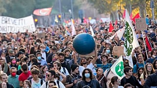 Demonstrators march in Rome, Saturday, Oct. 30, 2021, the day a Group of 20 summit started in the Italian capital.