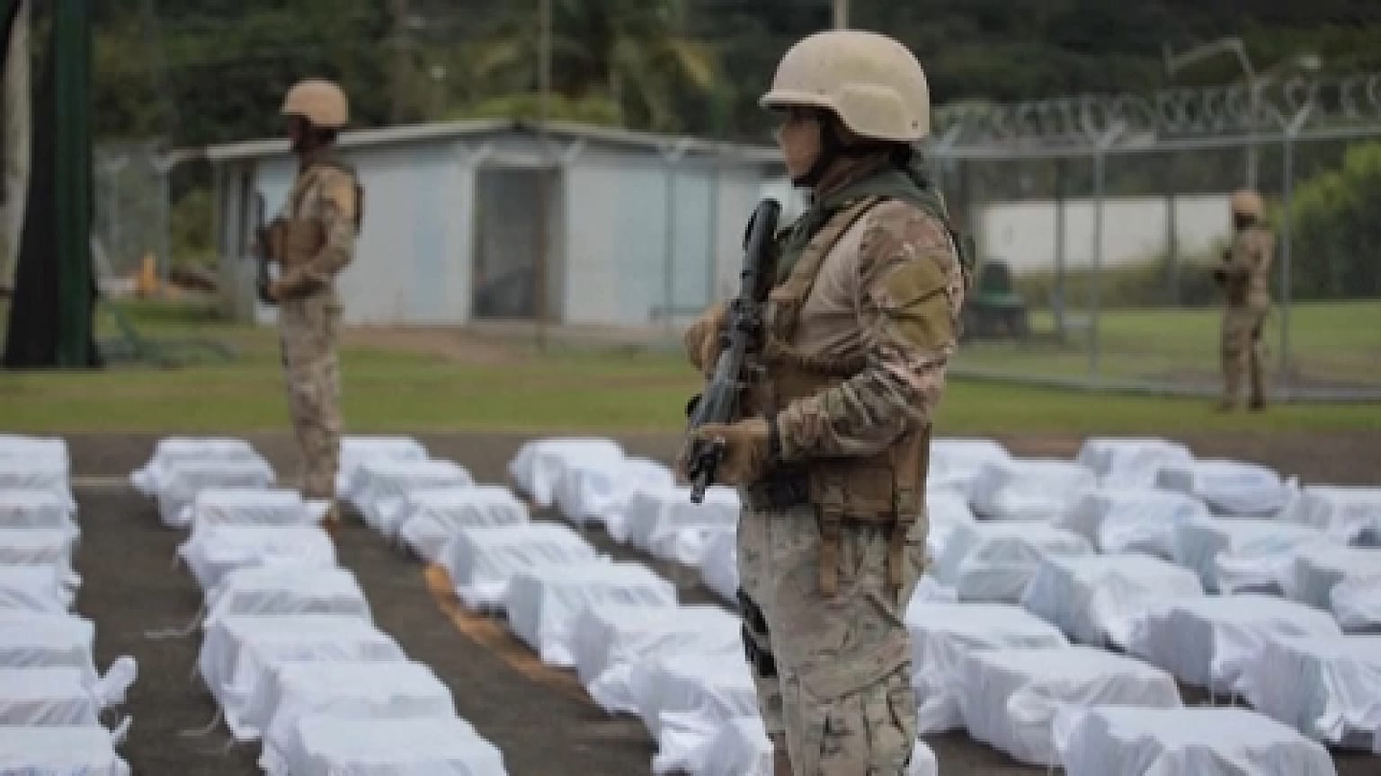 Member of the Panamanian National Air and Naval Service (SENAN) keeps custody of packages of suspected illicit substances that have been seized
