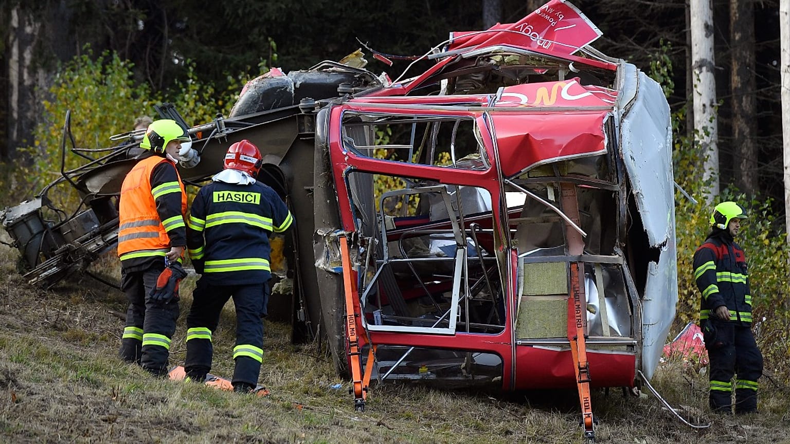 Rescuers work on a scene of a fallen funicular cab under the Mount Jested in Liberec, Czech Republic, on Sunday, Oct. 31, 2021.
