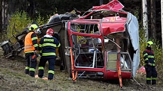 Rescuers work on a scene of a fallen funicular cab under the Mount Jested in Liberec, Czech Republic, on Sunday, Oct. 31, 2021.