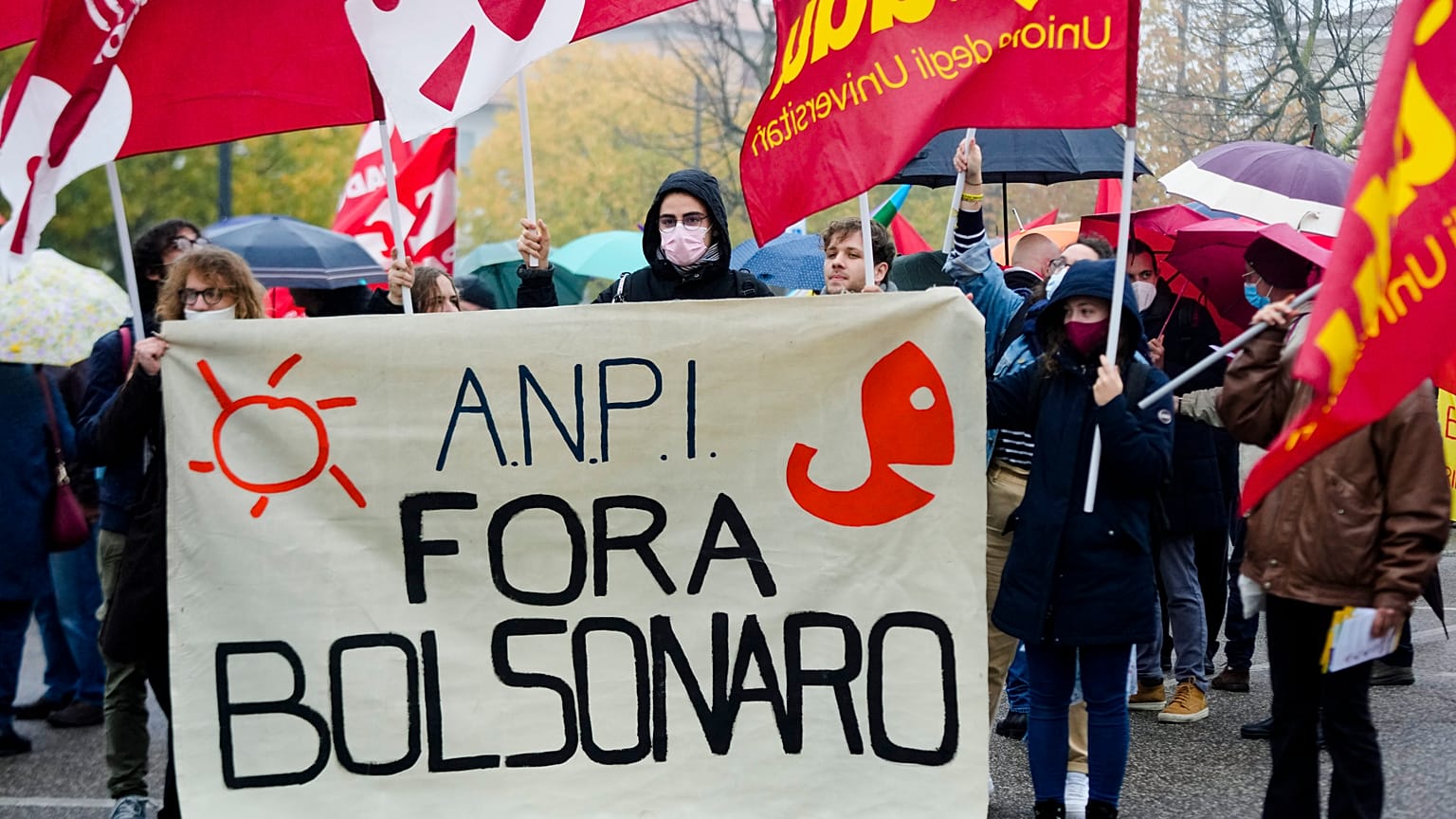 Italian Partisans Association activists march with a banner reading "Bolsonaro out".