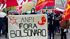 Italian Partisans Association activists march with a banner reading "Bolsonaro out".