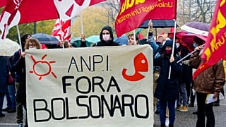 Italian Partisans Association activists march with a banner reading "Bolsonaro out".