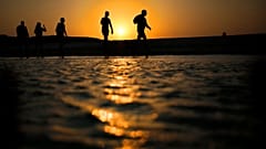 Tourists walk on the Giftun Island beach at the Red Sea resort of Hurghada.