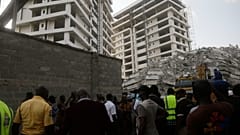 Rescue workers are seen at the site of a collapsed 21-story apartment building under construction in Lagos, Nigeria, Monday, Nov. 1, 2021.
