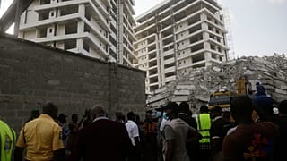 Rescue workers are seen at the site of a collapsed 21-story apartment building under construction in Lagos, Nigeria, Monday, Nov. 1, 2021.