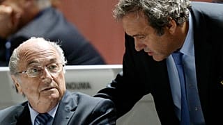 FIFA President Sepp Blatter, left, and UEFA President Michel Platini are engaged in conversation during the 65th FIFA Congress in Zurich, Switzerland, May 29, 2015. 