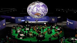 Delegates gather inside the venue on another day at the COP26 UN Climate Summit in Glasgow, Scotland, Wednesday, Nov. 3, 2021.