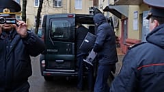 Belarusian Interior Ministry officer pitcured near the office of Belsat channel in 2017.