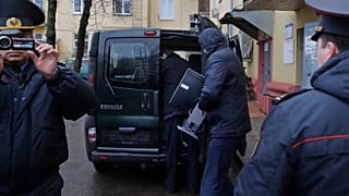 Belarusian Interior Ministry officer pitcured near the office of Belsat channel in 2017.