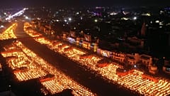 People light lamps on the banks of the river Saryu in Ayodhya, India, Wednesday, Nov. 3, 2021. 