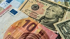 Euros and US dollar bills