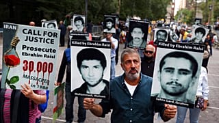 Protesters call for Iranian president Ebrahim Raisi to be prosecuted at a rally in New York in September