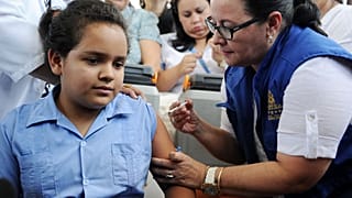 Many children around the world - including this girl in Honduras - are now vaccinated against the cancer-causing human papillomavirus (HPV)