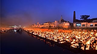 People lighting lamps on the banks of the river Sarayu, Ayodhya