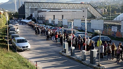 People wait in lines to get a vaccine in Sarajevo, Bosnia, Saturday, Sept. 25, 2021.