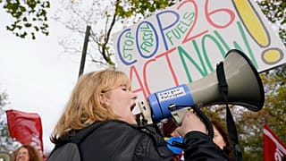 Climate activists march through the streets of Glasgow, Scotland, Friday, Nov. 5, 2021 