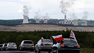 Cars block the border between the Czech Republic and Poland near the Turow coal mine.