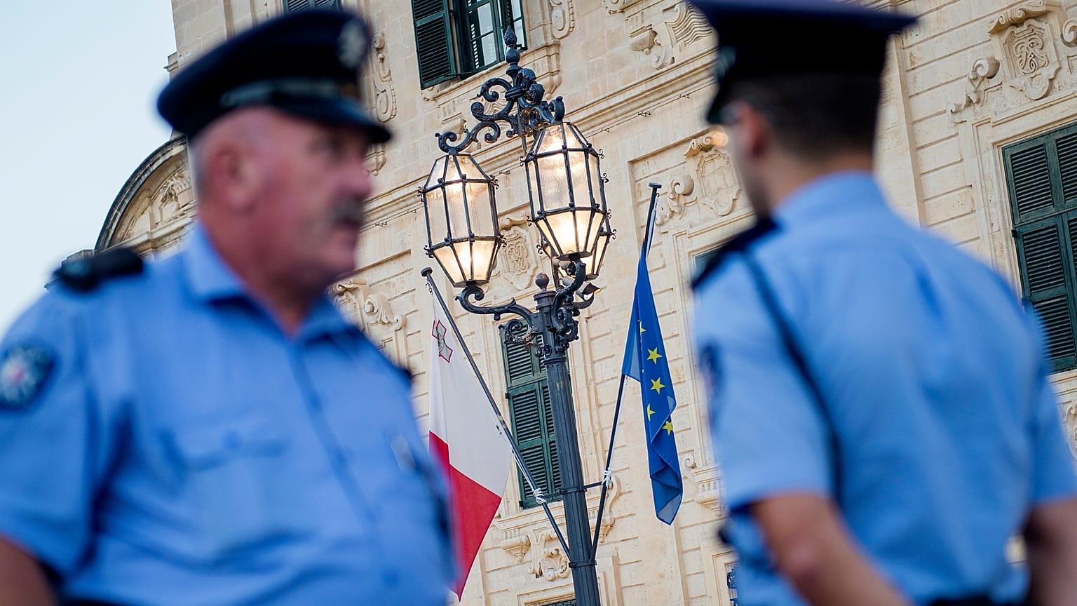 Police officers patrol in Castile square, outside the office of the prime minister in Malta.