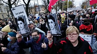 Protestors gather outside Poland's Constitutional Tribunal in Warsaw, Poland, on Saturday, Nov. 6, 2021