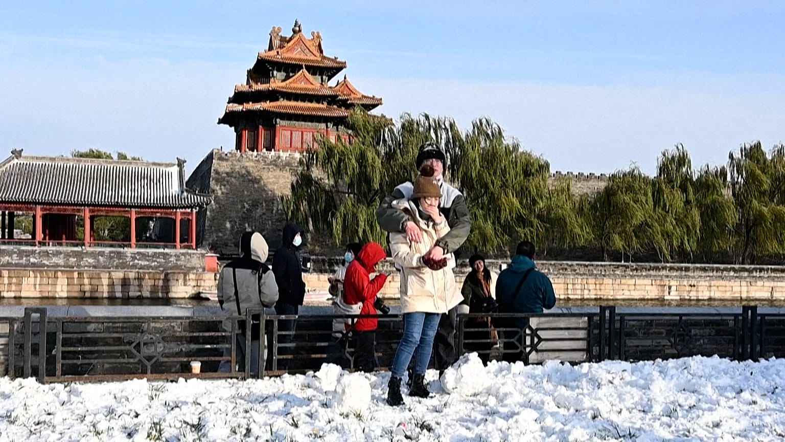 Couple in front of tower in the Forbidden city