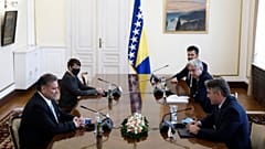 US Deputy Assistant Secretary of State Gabriel Escobar, left, speaks with the Croat member of the Bosnian Presidency Zeljko Komsic.