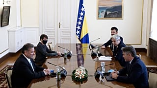 US Deputy Assistant Secretary of State Gabriel Escobar, left, speaks with the Croat member of the Bosnian Presidency Zeljko Komsic.