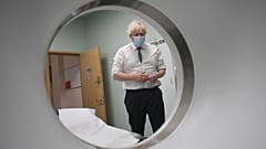 Britain's Prime Minister Boris Johnson is shown around a CT scan room during a visit to Hexham General Hospital in Northumberland, England, Monday, Nov. 8, 2021. 