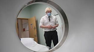 Britain's Prime Minister Boris Johnson is shown around a CT scan room during a visit to Hexham General Hospital in Northumberland, England, Monday, Nov. 8, 2021.