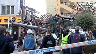 Emergency workers at the site of the collapsed building in Malatya.