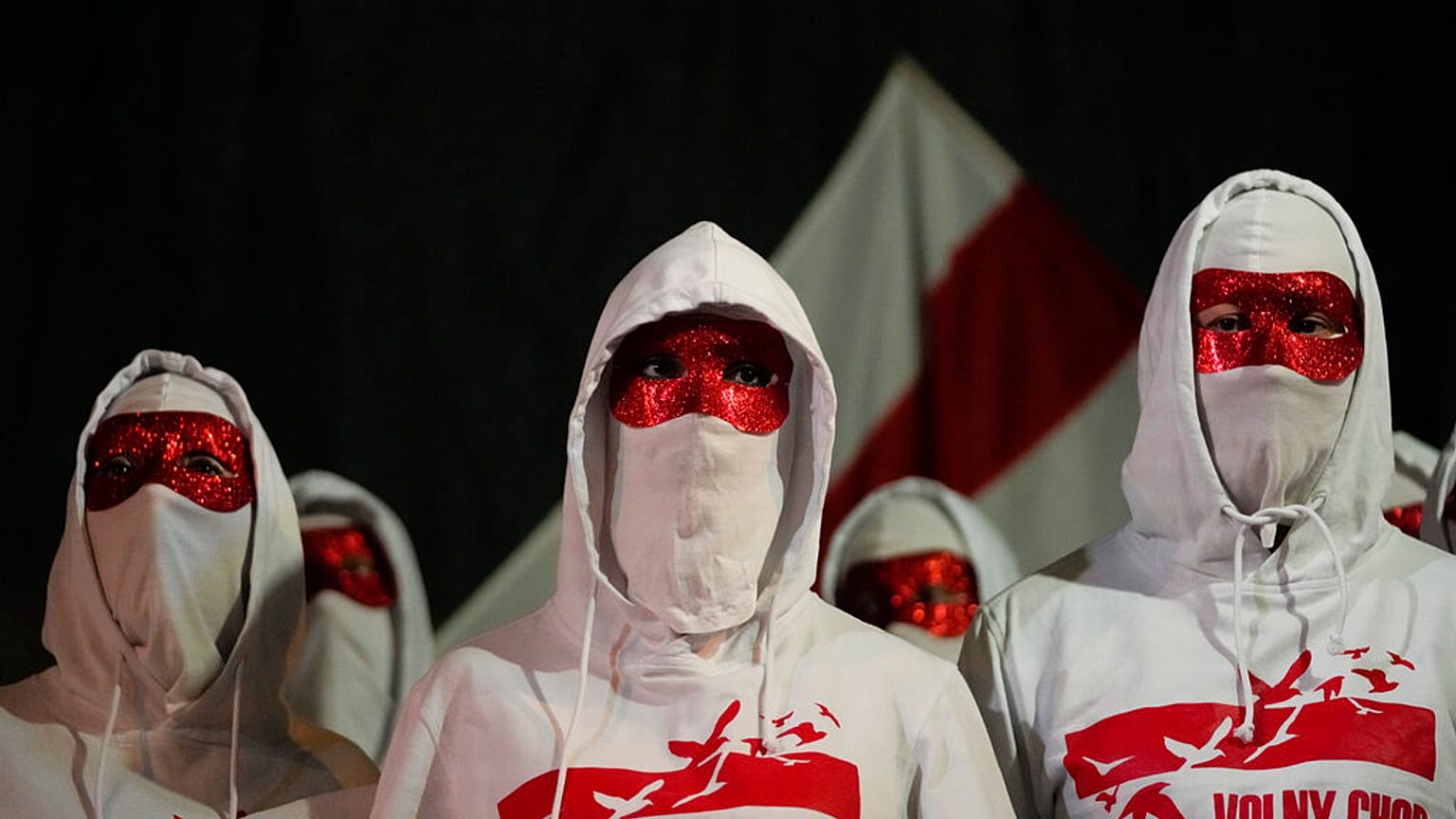 Members of the Volny Chor attend a demonstration against the Belarus government at the Brandenburg Gate in Berlin, Germany, Tuesday, Nov. 9, 2021. 