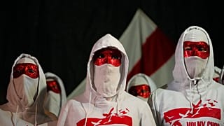 Members of the Volny Chor attend a demonstration against the Belarus government at the Brandenburg Gate in Berlin, Germany, Tuesday, Nov. 9, 2021. 