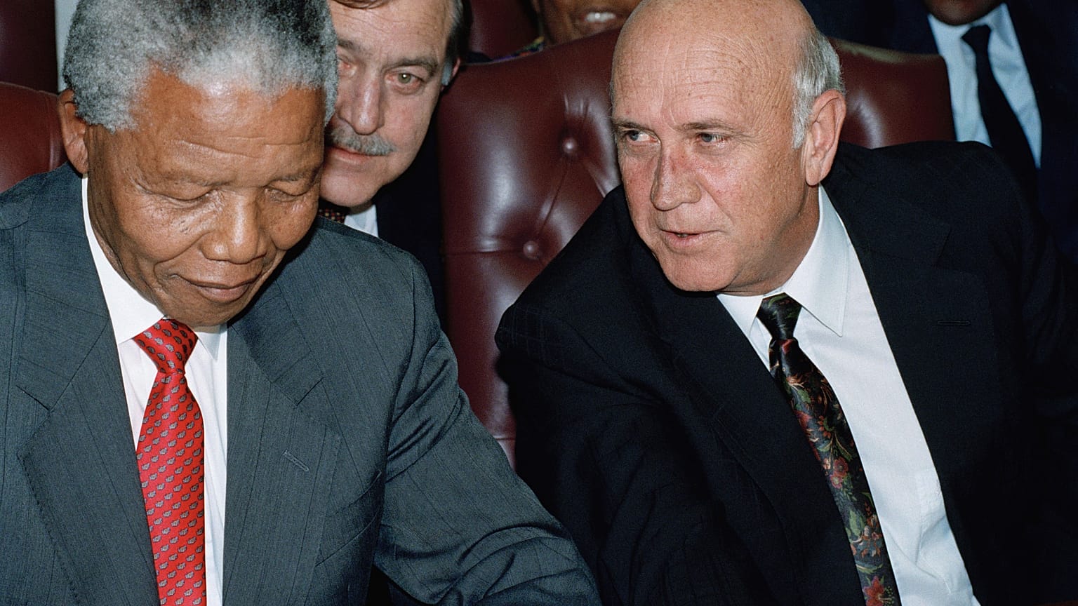 President F.W. de Klerk, right, has a word with African National Congress President Nelson Mandela, during a meeting in Gaborone, Botswana Jan. 27, 1994