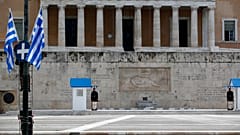 Municipal workers install Greek flags in front of the Greek parliament.